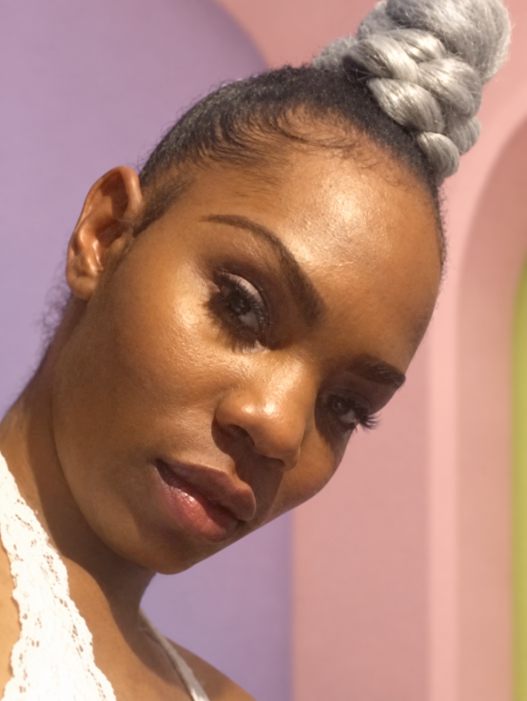 Jasmine Newsome against a soft pink and lavender background